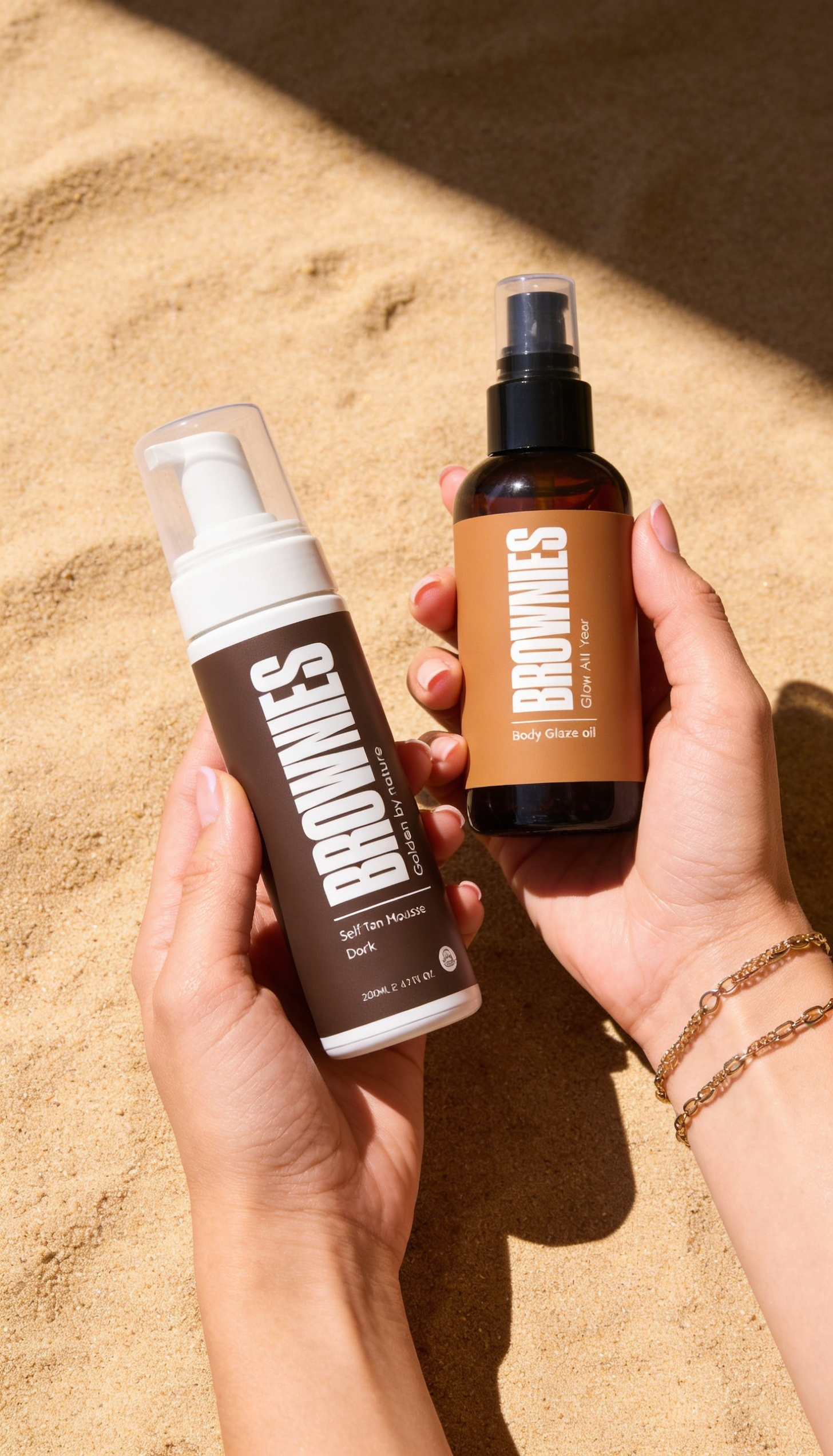 Brownies mousse and Body Glaze Oil held over warm sand - The Smooth Starter bundle