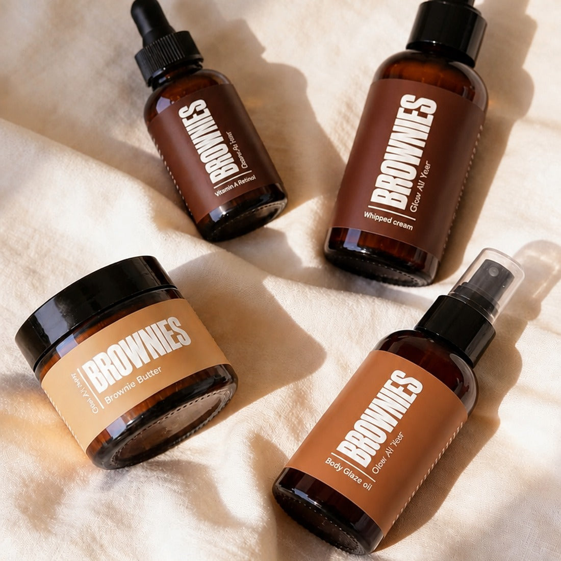The Total Smooth Set - Brownies mousse Brownie Butter Body Glaze Oil and Silk Melt Serum flat-lay